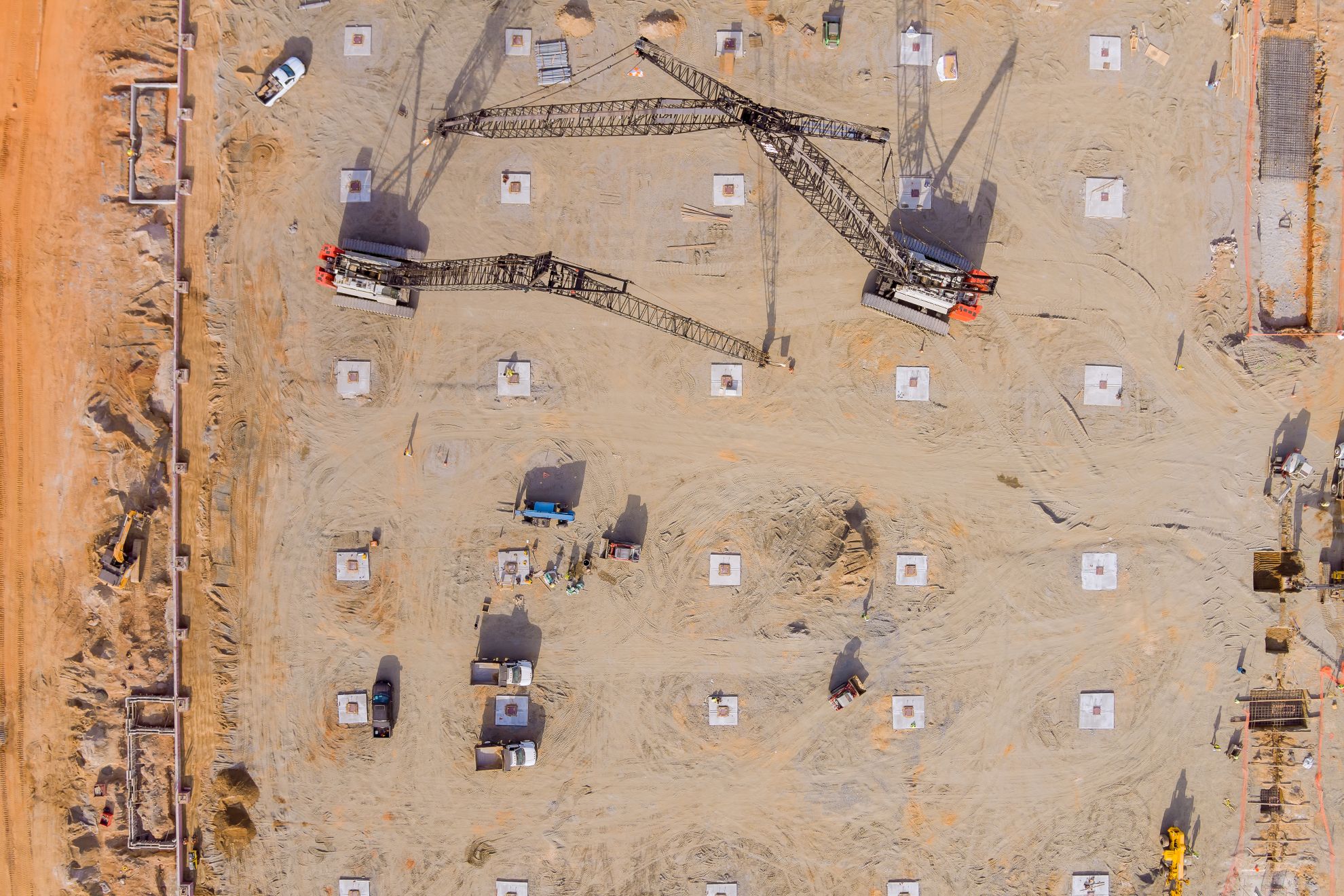 Drone aerial photo of commercial construction cranes on a Colorado industrial development